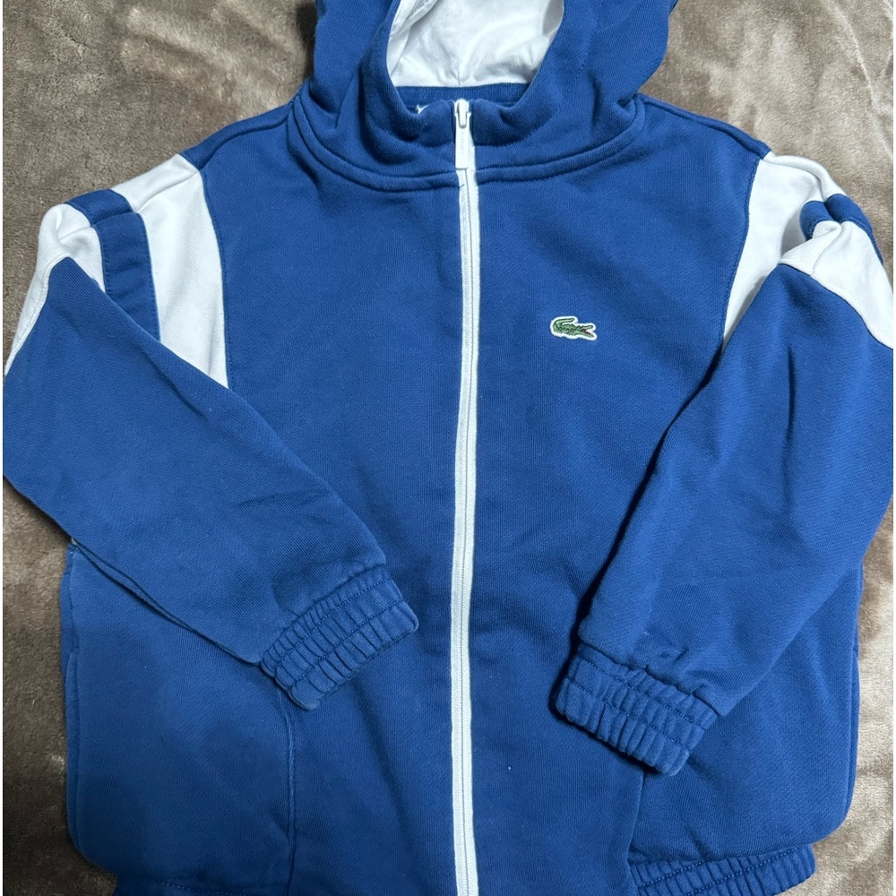 Lacoste blue boys size 3T zipper sweater with hood. Still in great condition.